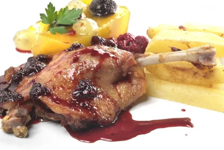 Confit de pato con salsa de cítricos y miel con risotto picante de setas